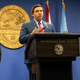 Florida Governor Ron DeSantis (center) speaks during a press conference relating hurricane season updates at the Miami-Dade Emergency Operations Center on June 8, 2020, in Miami, Florida.